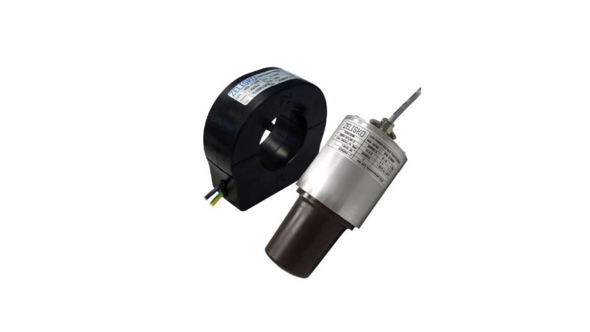 Two industrial electrical components: a black ring-shaped current transformer and a silver cylindrical device with labels and attached wires, both placed on a white background.