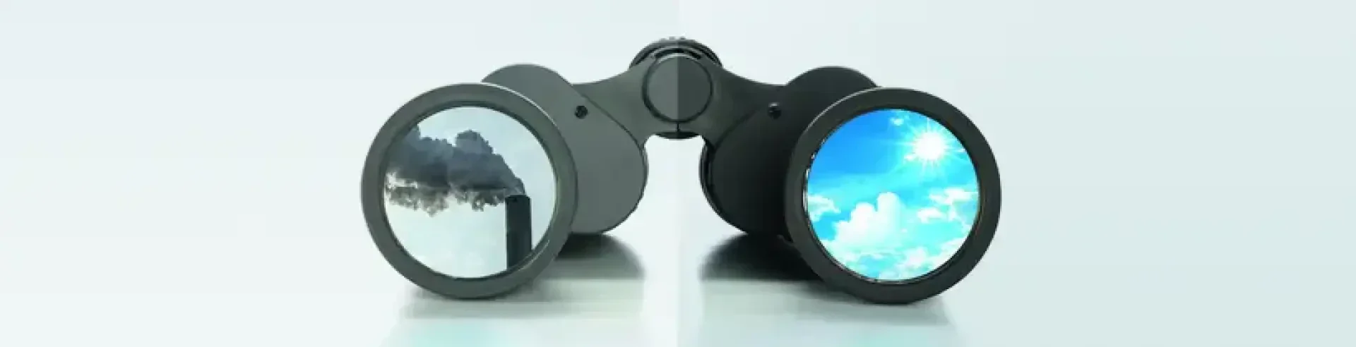 A pair of binoculars shows two contrasting scenes: one lens reflects pollution with smoke rising from a chimney, while the other displays a bright, clear sky with sunlight and clouds.