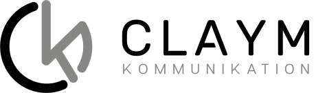 Logo mit einem stilisierten kleinen k in Grau, gefolgt vom Wort KOMMUNIKATION in großen grauen Buchstaben auf transparentem Hintergrund.