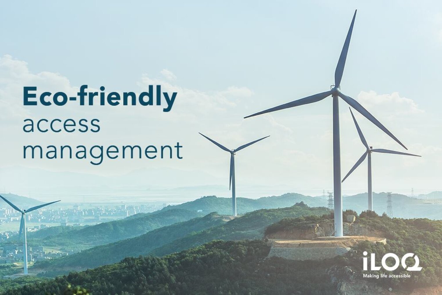 Three wind turbines on green hills overlooking a distant city, with the text Eco-friendly access management and the iLOQ logo in the bottom right corner.